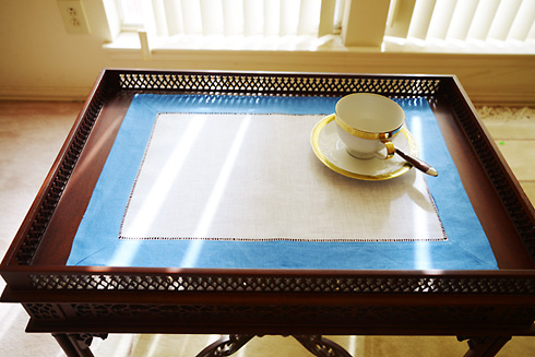 Place Mat. French Blue colored trimming.